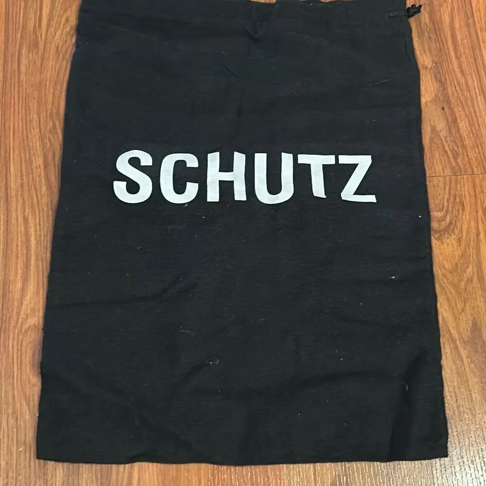 Schultz black and white shoe bag dust